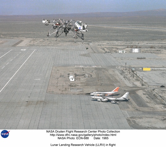 In this 1965 NASA Flight Reserch Center photograph the Lunar Landing Research Vehicle (LLRV) is shown at near maximum altitude over the south base at Edwards Air Force Base.