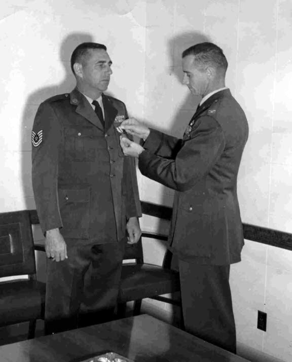 Command Post, 1129th Special Activities Squadron, Groom Lake, Nevada - 1961 Col. Doug Nelson presenting me the USAF Commendation Medal for my reaccomplishment of the International  NOTAM System (circa 1959) while I was the NCOIC of Base Operations at Langley AFB, Va.