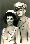In the wedding photo, my mother is wearing a pair of his wings on her dress. He couldn't afford an engagement ring back then, so he gave her the wings he received when he graduated from Aviation Cadets as an engagement gift.
