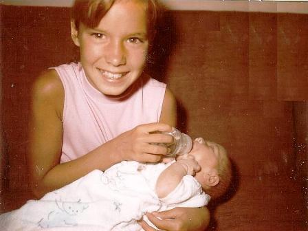 Debbie Roussell feeding Scott Simon, son of Jim and Laura Simon